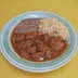 Asado de puerco rojo con frijoles refritos y arroz